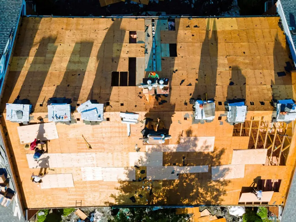 In order to repair roof of an apartment building, new shingles were installed and plywood was